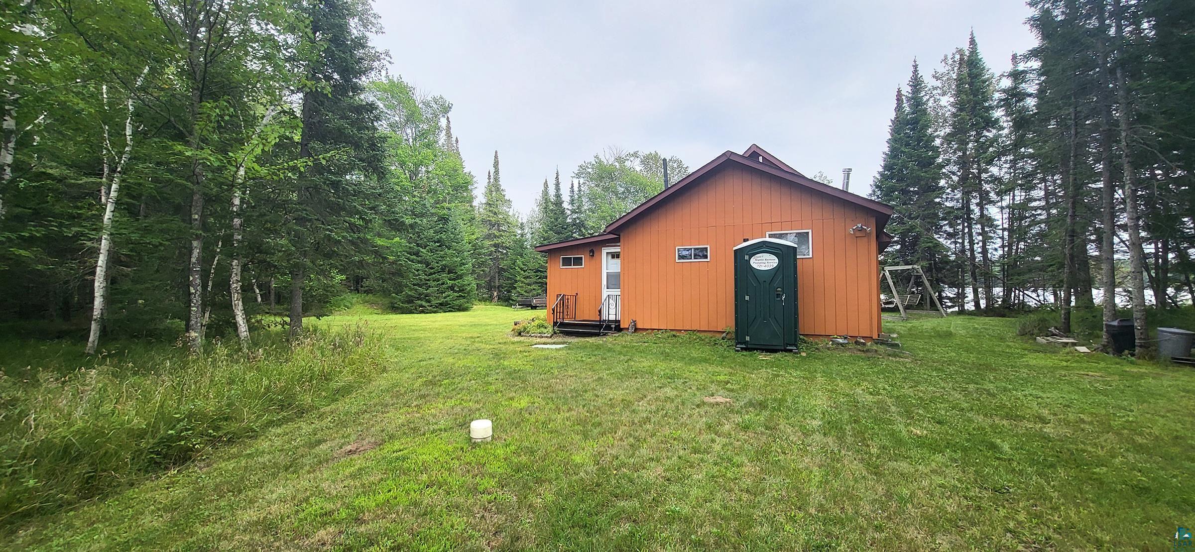5152 Birch Isle Road Duluth, MN 55803 - Photo 8 of 32 Exterior space featuring an outdoor structure and a yard