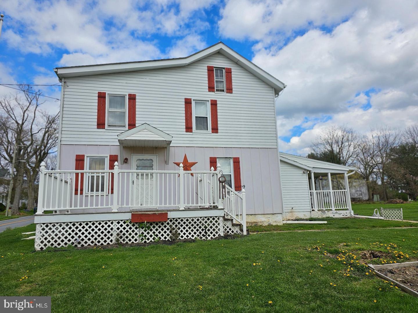 271 England Creamery Road North East, MD 21901 - Photo 1 of 14 a front view of a house with a garden