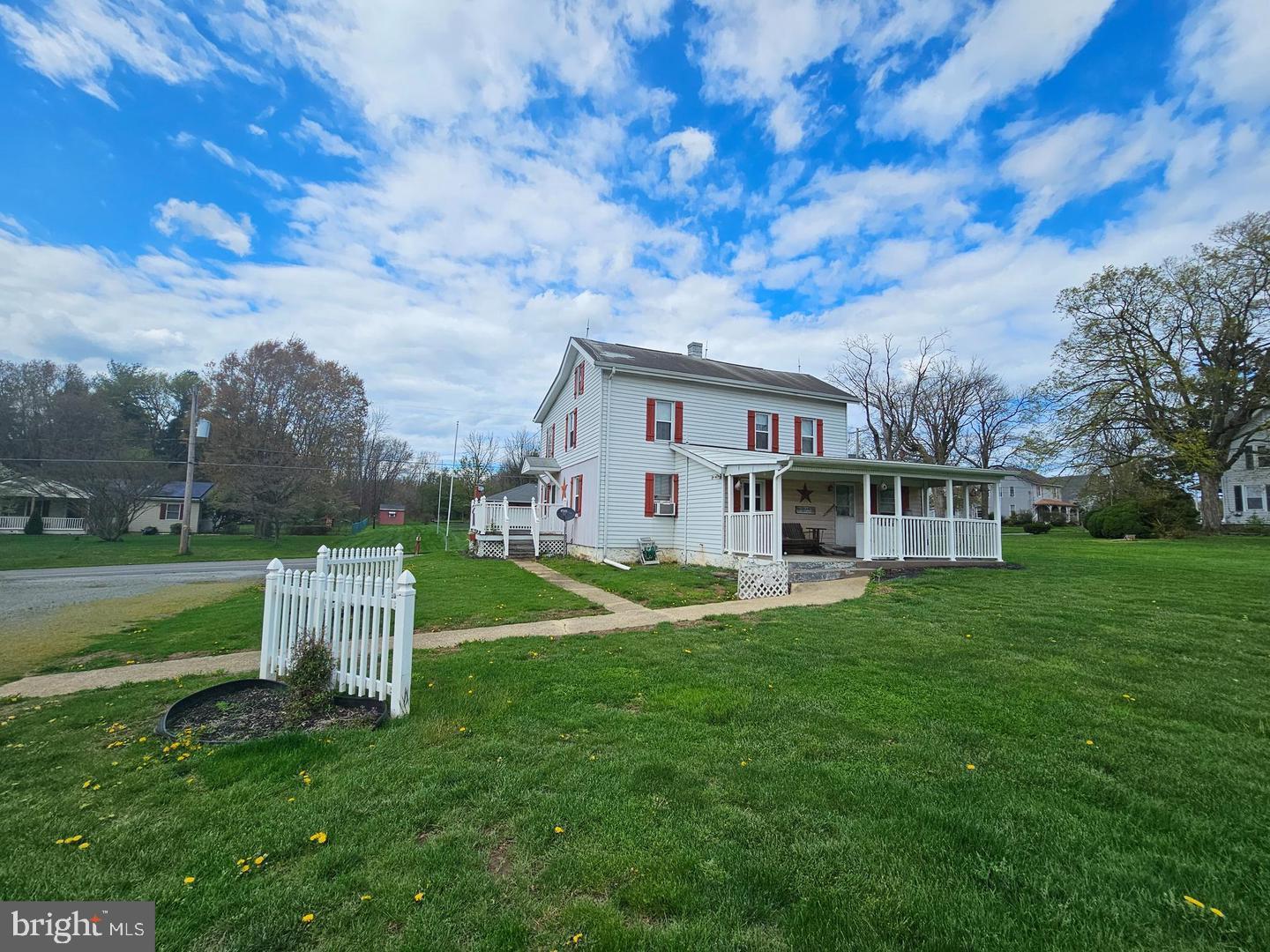 271 England Creamery Road North East, MD 21901 - Photo 7 of 14 a view of a house with a big yard and large trees