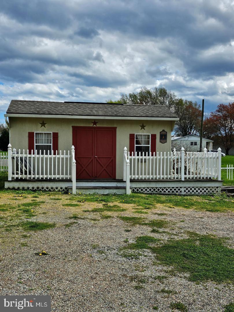 271 England Creamery Road North East, MD 21901 - Photo 8 of 14 a backyard of a house with table and chairs