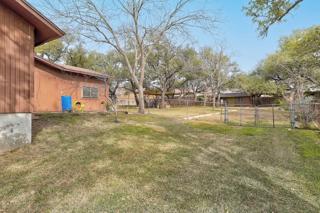 8606 Thunderbird Road, Unit A & B Austin, TX 78736 - Photo 33 of 33 a view of a yard with a house