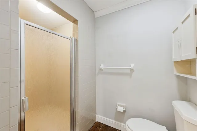 a white toilet sitting next to a bathroom sink