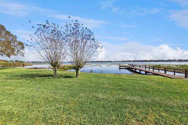 a view of a lake with houses in the back