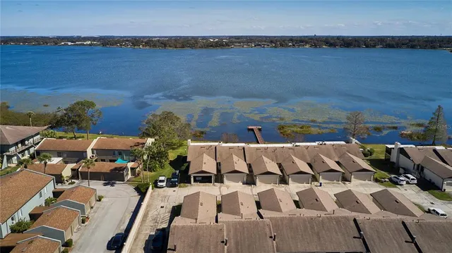 an aerial view of a house with outdoor space