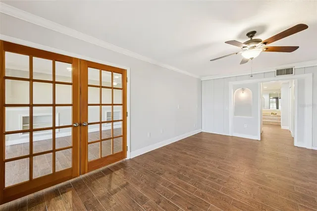 wooden floor in an empty room with a window