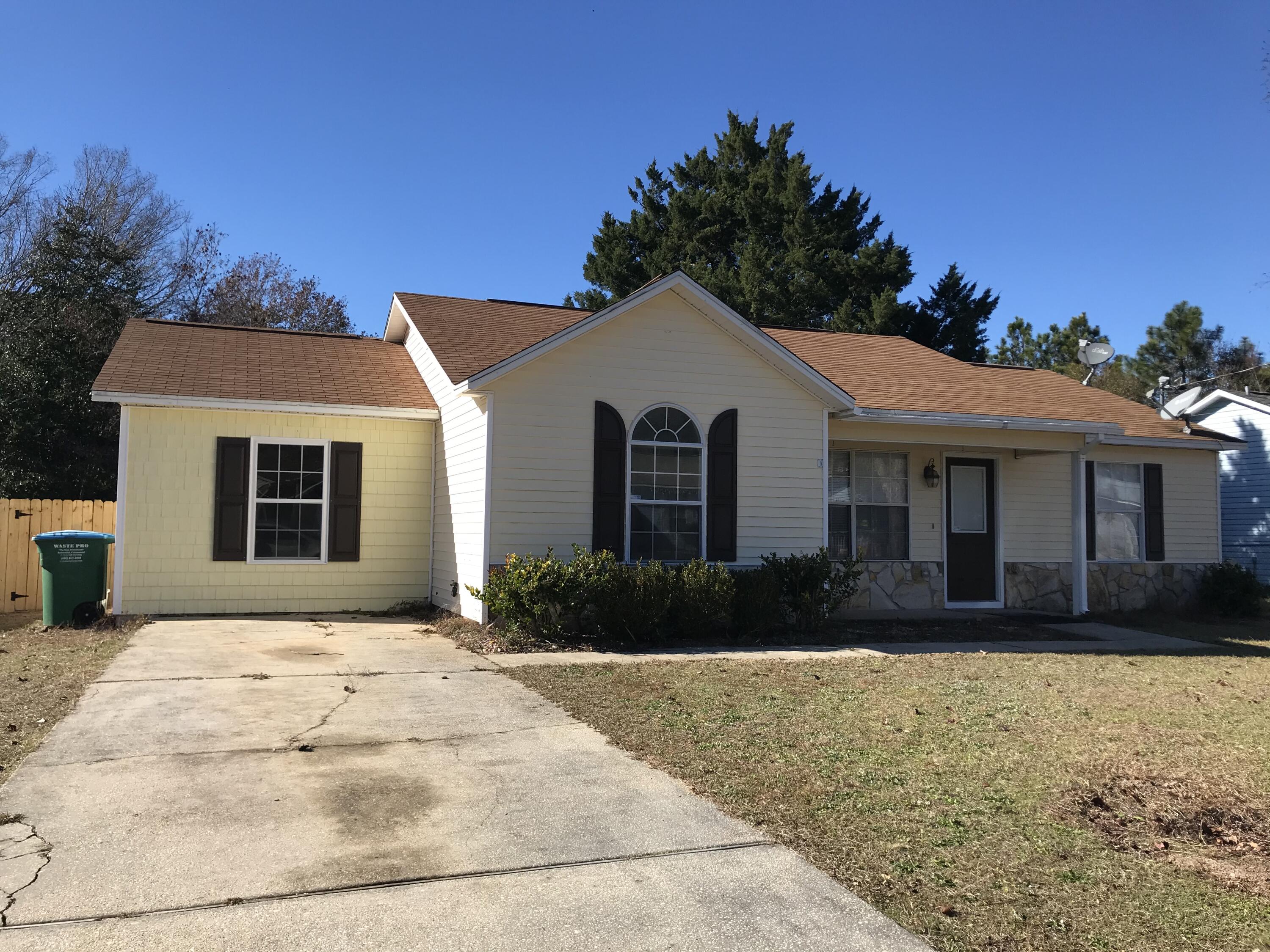 113 Oak Terrace Drive Crestview, FL 32539 - Photo 1 of 21 a front view of a house with a yard