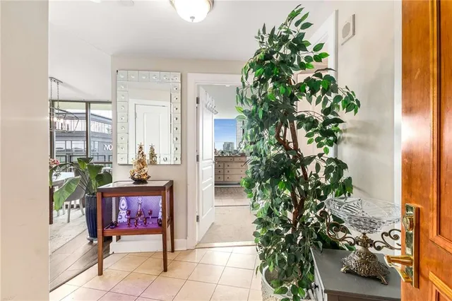 an entryway with flower pot and wooden floor