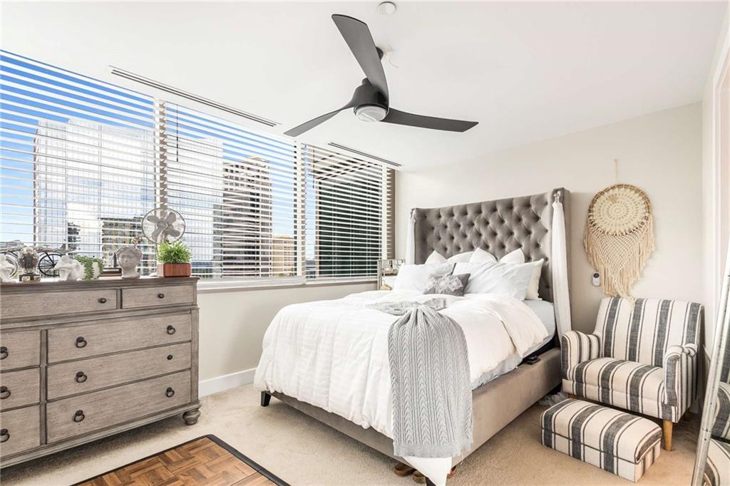 700 Park Regency Place Northeast, Unit 1603 Atlanta, GA 30326 - Photo 20 of 25 a bedroom with a bed and with furniture