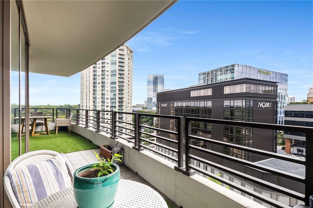 700 Park Regency Place Northeast, Unit 1603 Atlanta, GA 30326 - Photo 23 of 25 a view of a chairs and table in the balcony