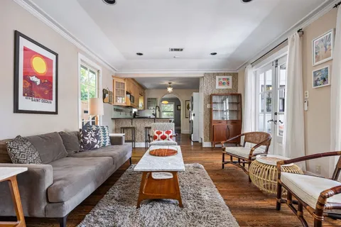 a living room with furniture or couch and a large window