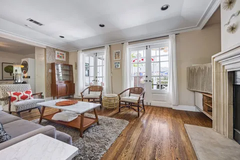 a living room with furniture and a fireplace