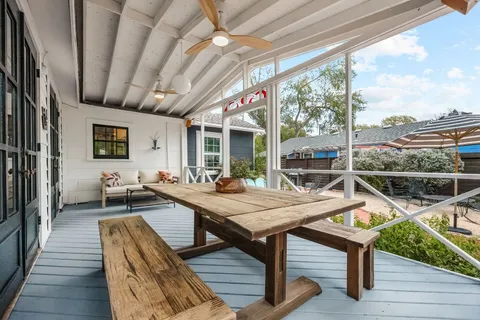 a dinning table and chairs in the balcony