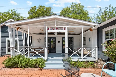 a front view of house with yard and seating