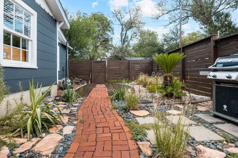 a view of a backyard with sitting area