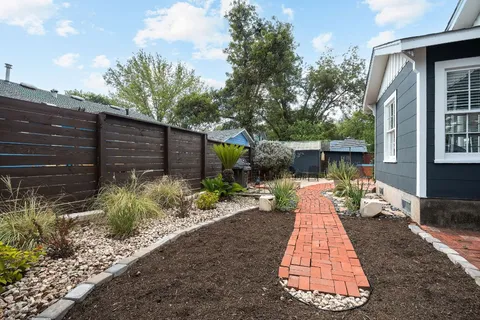 a front view of a house with garden