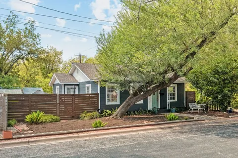 a view of a house with a street