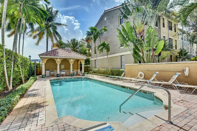 a view of swimming pool with lounge chair