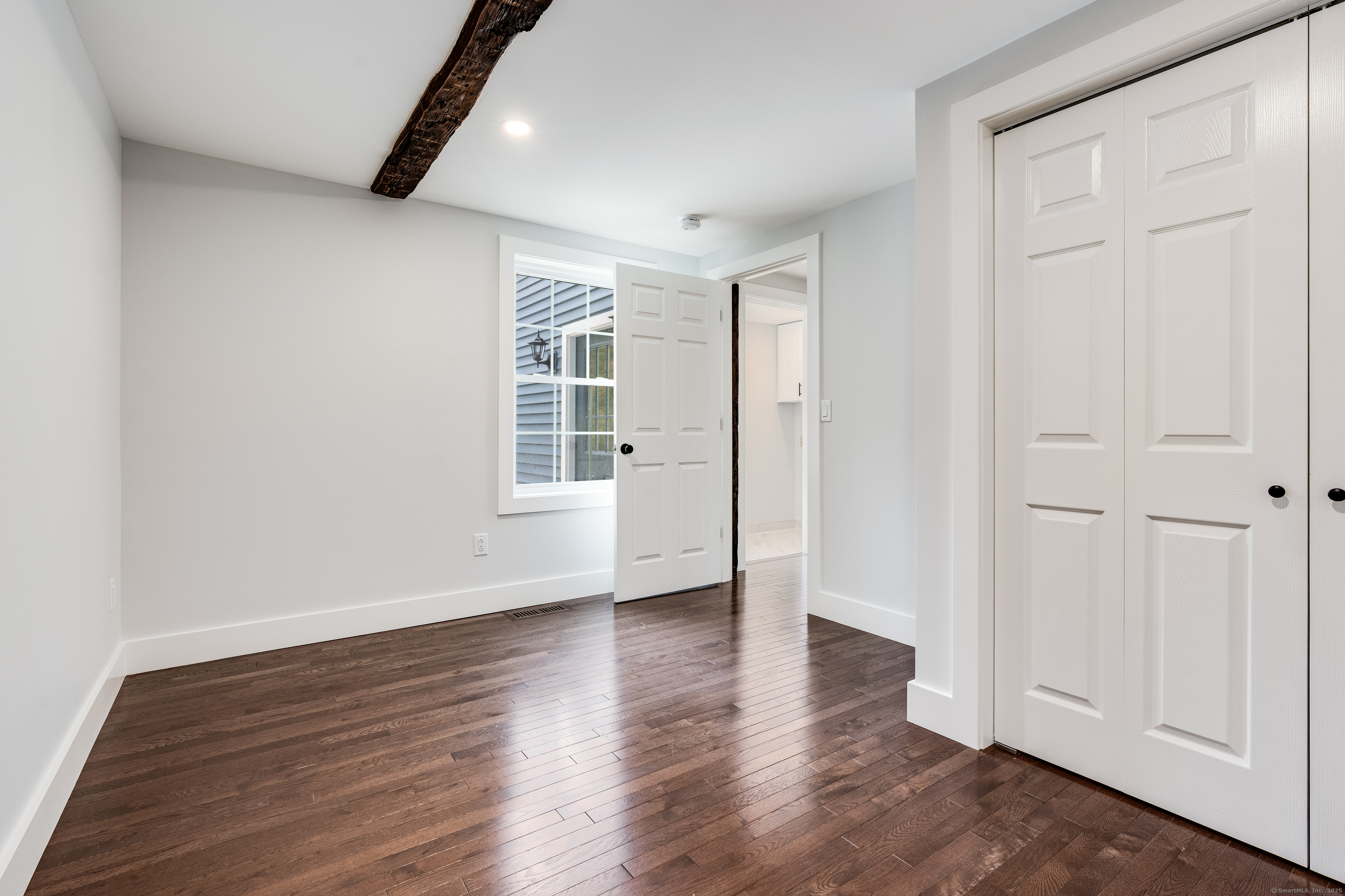 60 Goose Hill Road Chester, CT 06412 - Photo 11 of 35 a view of an empty room with wooden floor and a window