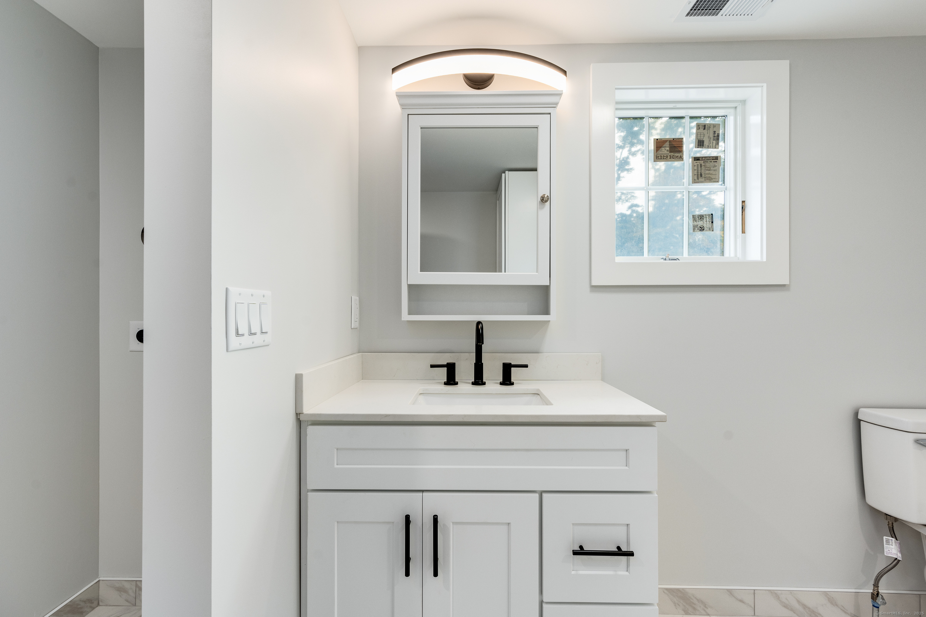 60 Goose Hill Road Chester, CT 06412 - Photo 23 of 35 a bathroom with a sink and a mirror