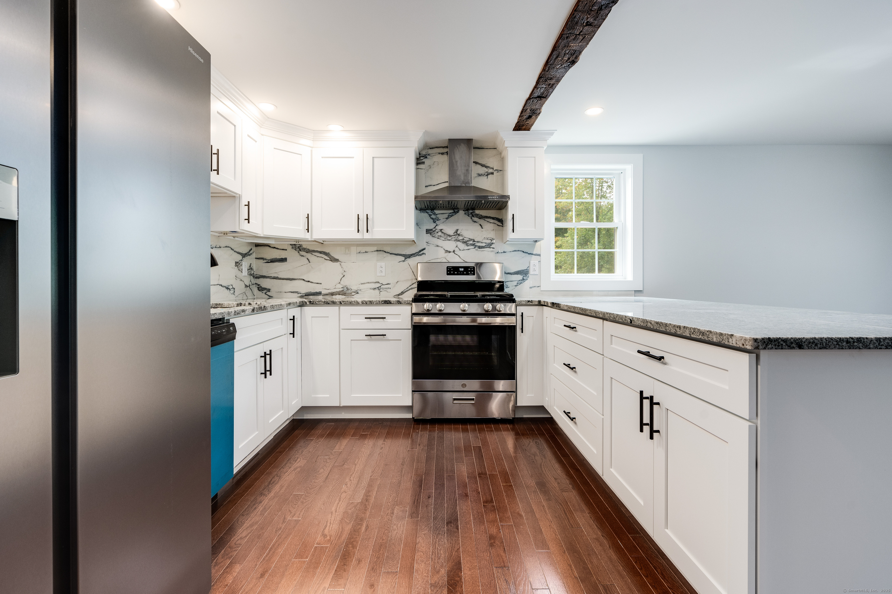 60 Goose Hill Road Chester, CT 06412 - Photo 4 of 35 a kitchen with stainless steel appliances a white stove top oven sink and cabinets