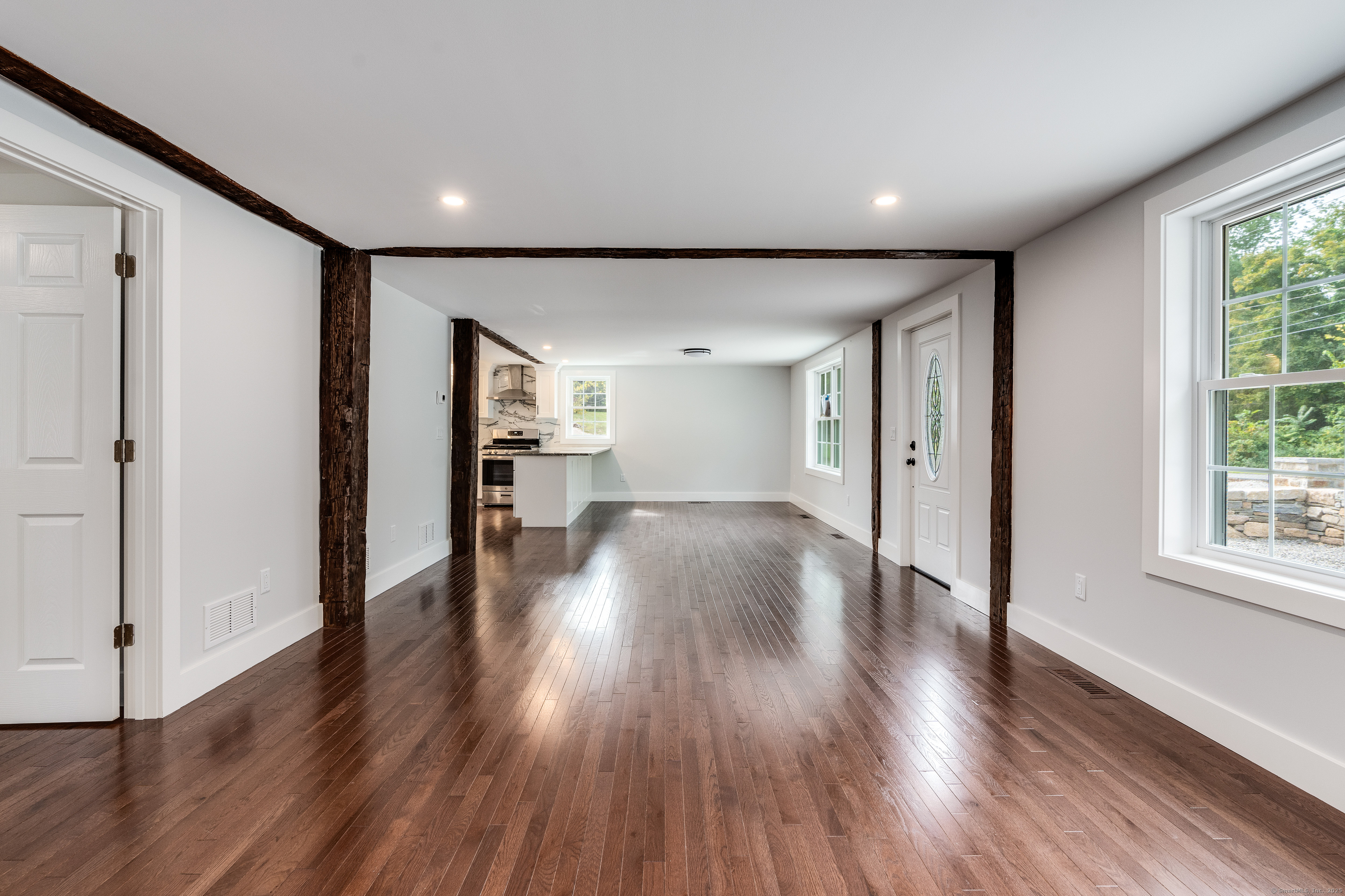 60 Goose Hill Road Chester, CT 06412 - Photo 6 of 35 a view of a big room with wooden floor and windows
