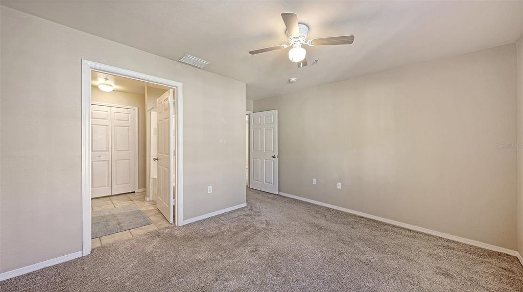 5520 Rosehill Road, Unit 203 Sarasota, FL 34233 - Photo 16 of 46 an empty room with a ceiling fan and a window