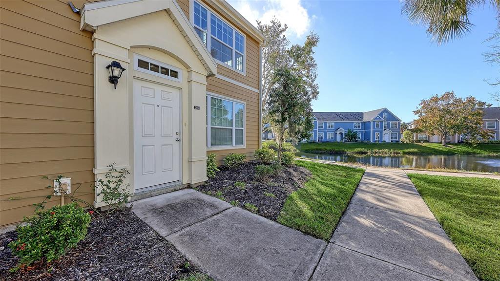 5520 Rosehill Road, Unit 203 Sarasota, FL 34233 - Photo 2 of 46 a front view of a house with garden