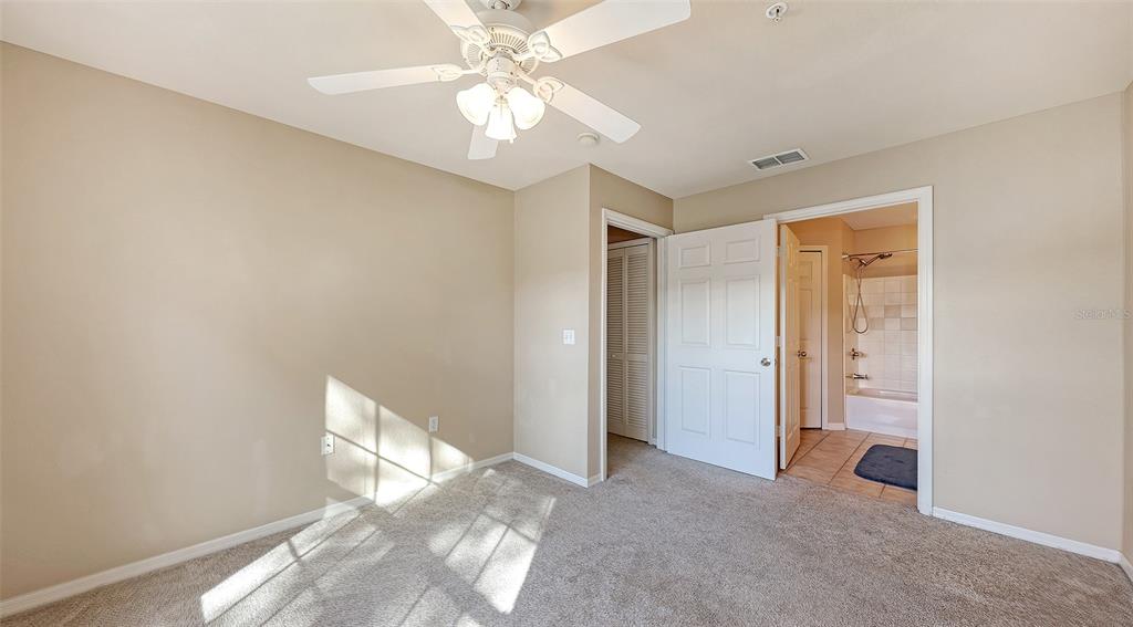 5520 Rosehill Road, Unit 203 Sarasota, FL 34233 - Photo 23 of 46 a view of a big room with windows and chandelier fan