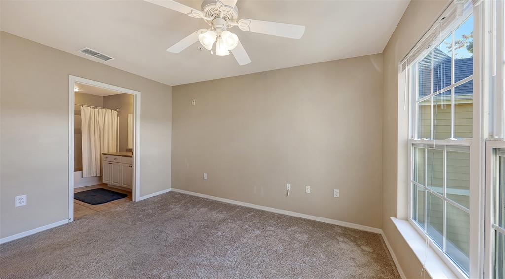 5520 Rosehill Road, Unit 203 Sarasota, FL 34233 - Photo 24 of 46 an empty room with a ceiling fan and a window