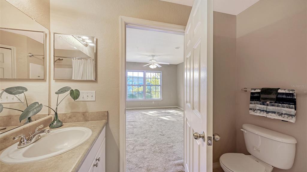 5520 Rosehill Road, Unit 203 Sarasota, FL 34233 - Photo 27 of 46 a bathroom with a sink toilet and shower