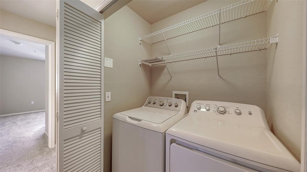 5520 Rosehill Road, Unit 203 Sarasota, FL 34233 - Photo 28 of 46 a utility room with dryer and washer