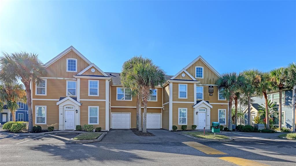 5520 Rosehill Road, Unit 203 Sarasota, FL 34233 - Photo 4 of 46 a front view of a house with a yard