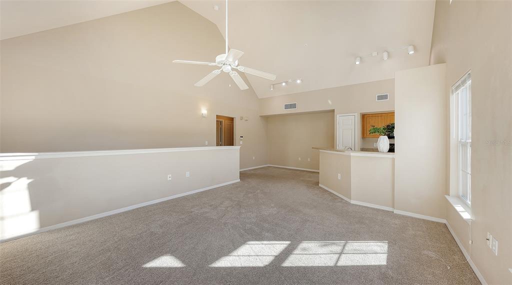 5520 Rosehill Road, Unit 203 Sarasota, FL 34233 - Photo 8 of 46 a view of a kitchen with a sink and a refrigerator