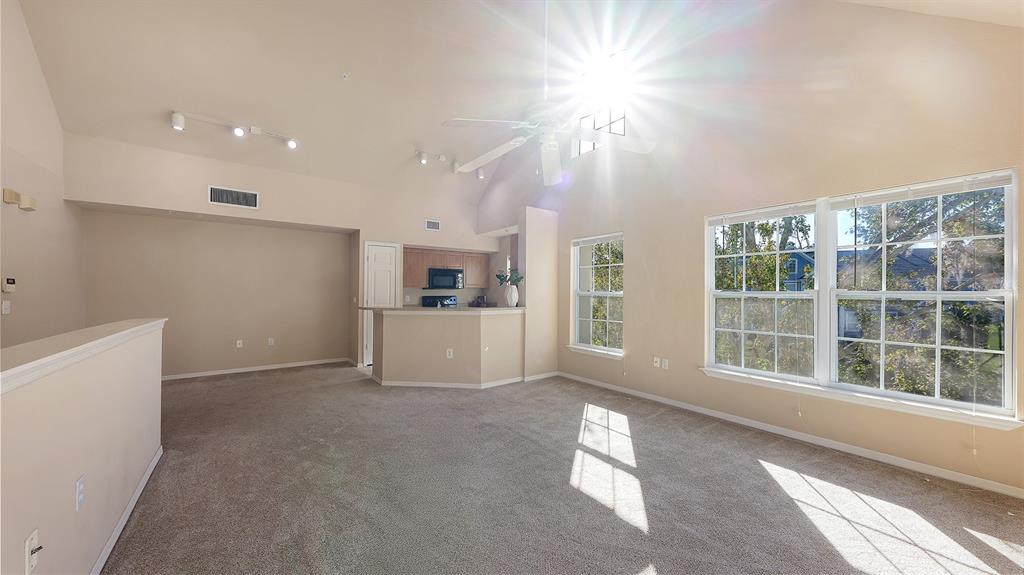 5520 Rosehill Road, Unit 203 Sarasota, FL 34233 - Photo 9 of 46 a view of livingroom with furniture cabinet and windows