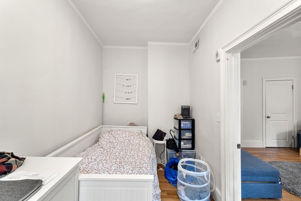 62 West Cedar Street, Unit 3 Boston, MA 02114 - Photo 13 of 18 a bathroom with a granite countertop sink and a mirror