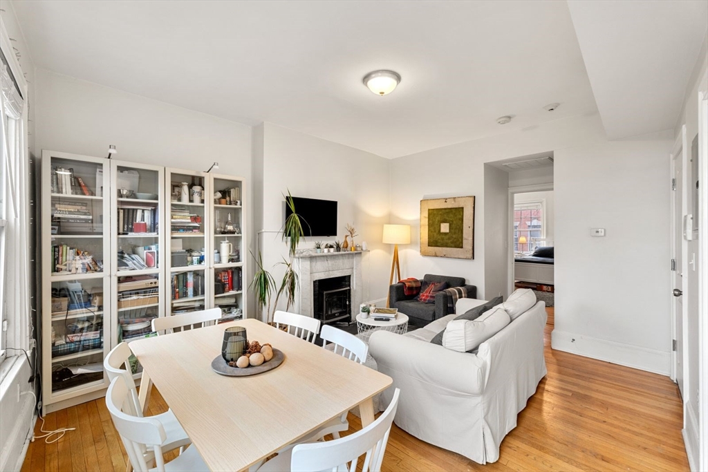 62 West Cedar Street, Unit 3 Boston, MA 02114 - Photo 3 of 18 a living room with furniture and a fireplace