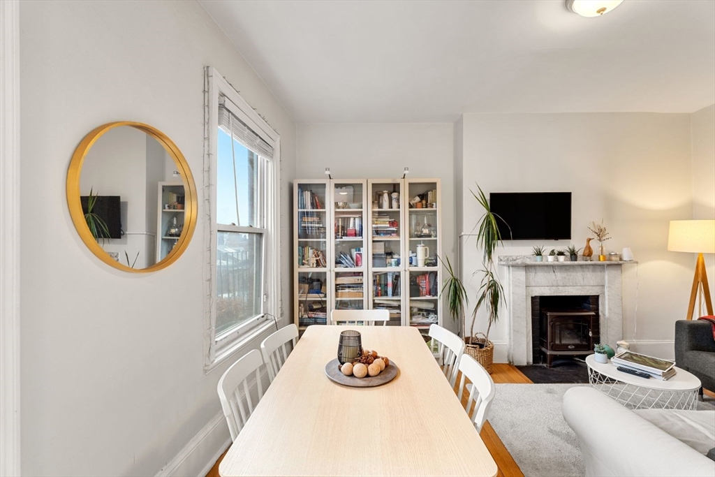 62 West Cedar Street, Unit 3 Boston, MA 02114 - Photo 5 of 18 a living room with fireplace furniture and a flat screen tv
