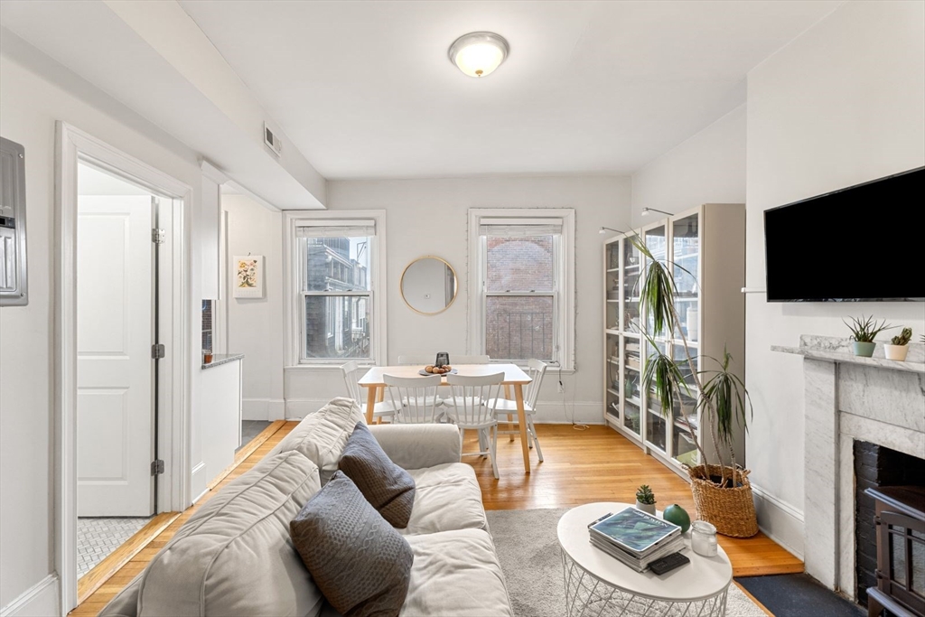 62 West Cedar Street, Unit 3 Boston, MA 02114 - Photo 6 of 18 a living room with furniture and a flat screen tv