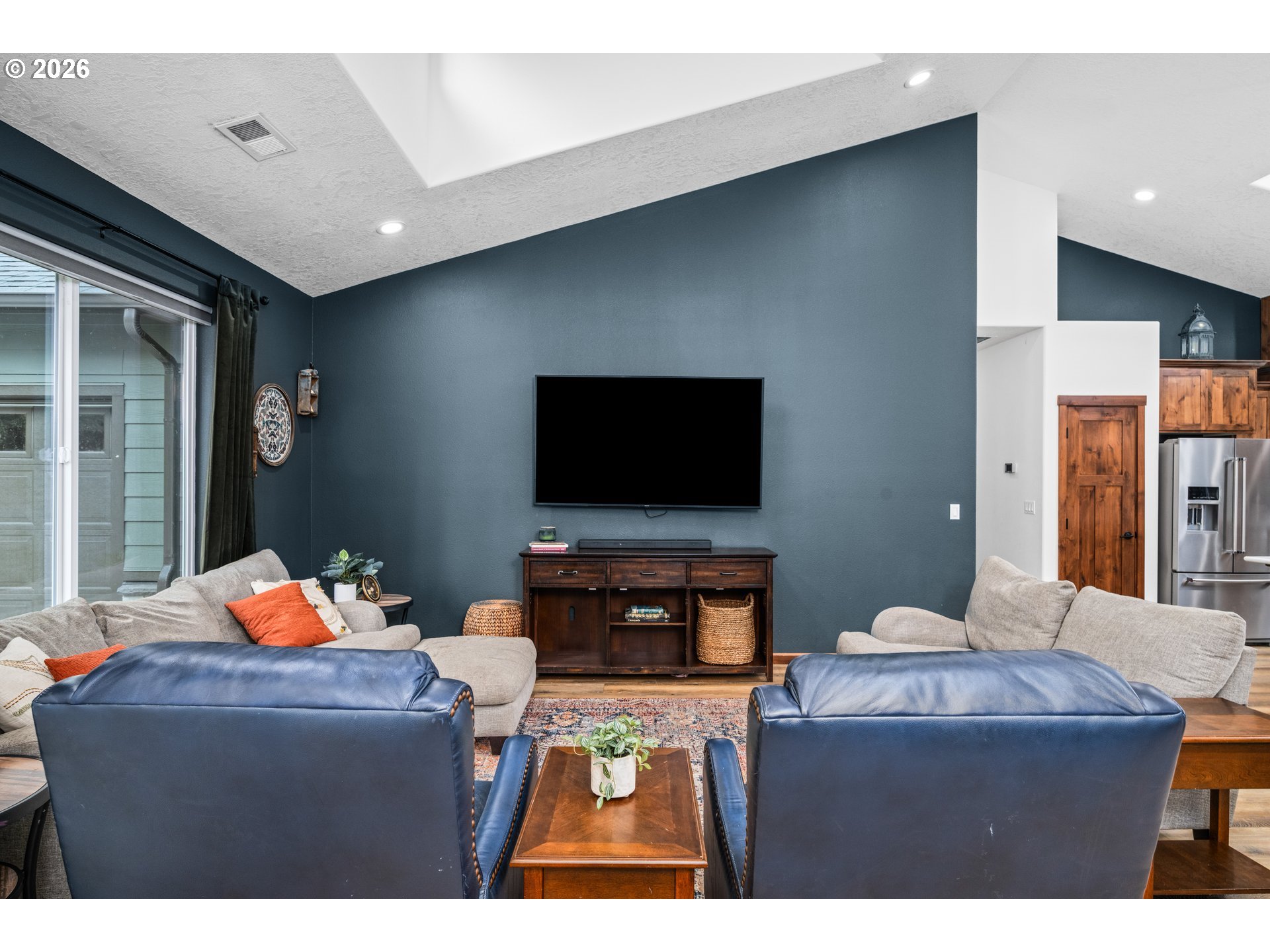 45542 South Gate Creek Road Vida, OR 97488 - Photo 26 of 46 a living room with furniture and a flat screen tv