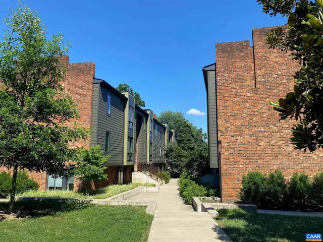 a view of a building with a yard