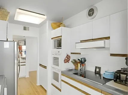 a kitchen with stainless steel appliances a refrigerator and cabinets
