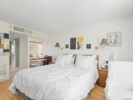 a large white bed in a white room