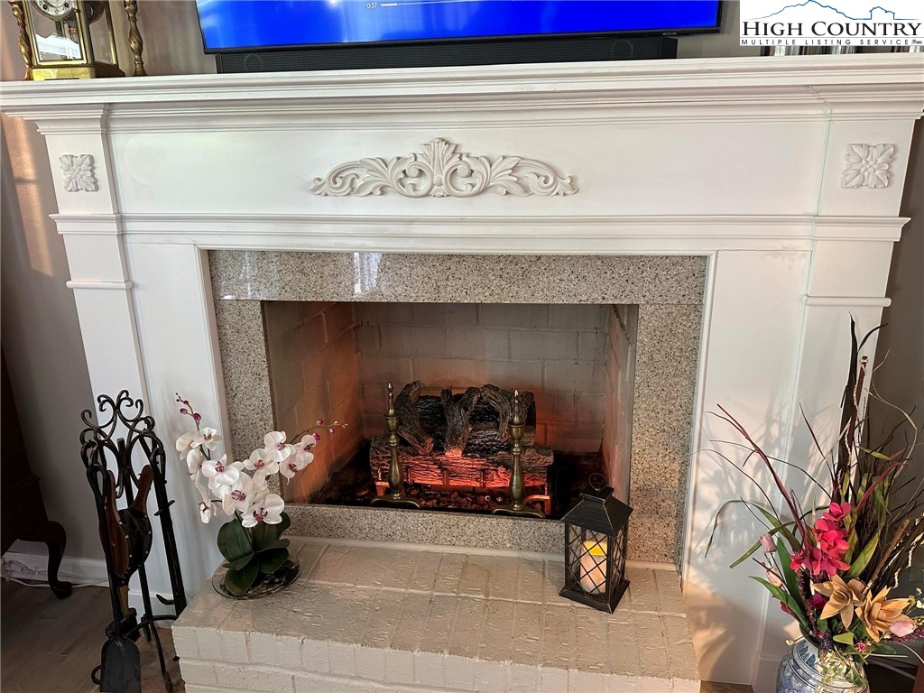 4952 Nile Road Sparta, NC 28675 - Photo 13 of 36 a living room with furniture and a fireplace