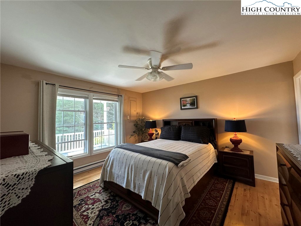 4952 Nile Road Sparta, NC 28675 - Photo 18 of 36 a bedroom with a bed and a large window