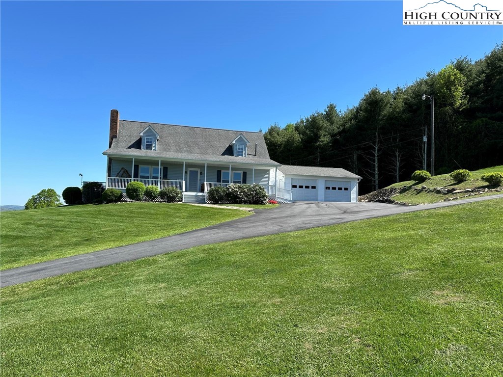 4952 Nile Road Sparta, NC 28675 - Photo 2 of 36 a front view of a house with garden