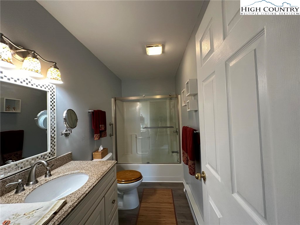 4952 Nile Road Sparta, NC 28675 - Photo 22 of 36 a bathroom with a granite countertop sink toilet and shower