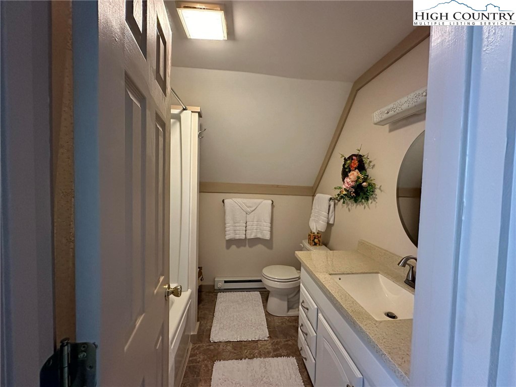 4952 Nile Road Sparta, NC 28675 - Photo 28 of 36 a bathroom with a sink and mirror with toilet