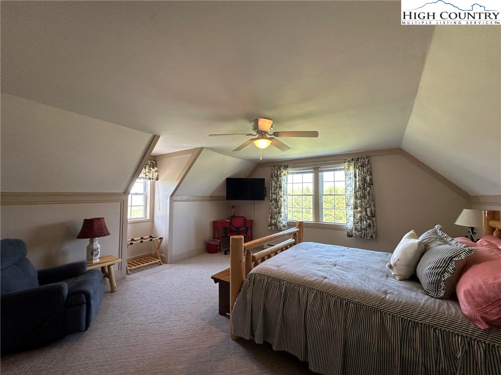 4952 Nile Road Sparta, NC 28675 - Photo 31 of 36 a bedroom with a bed couch and window