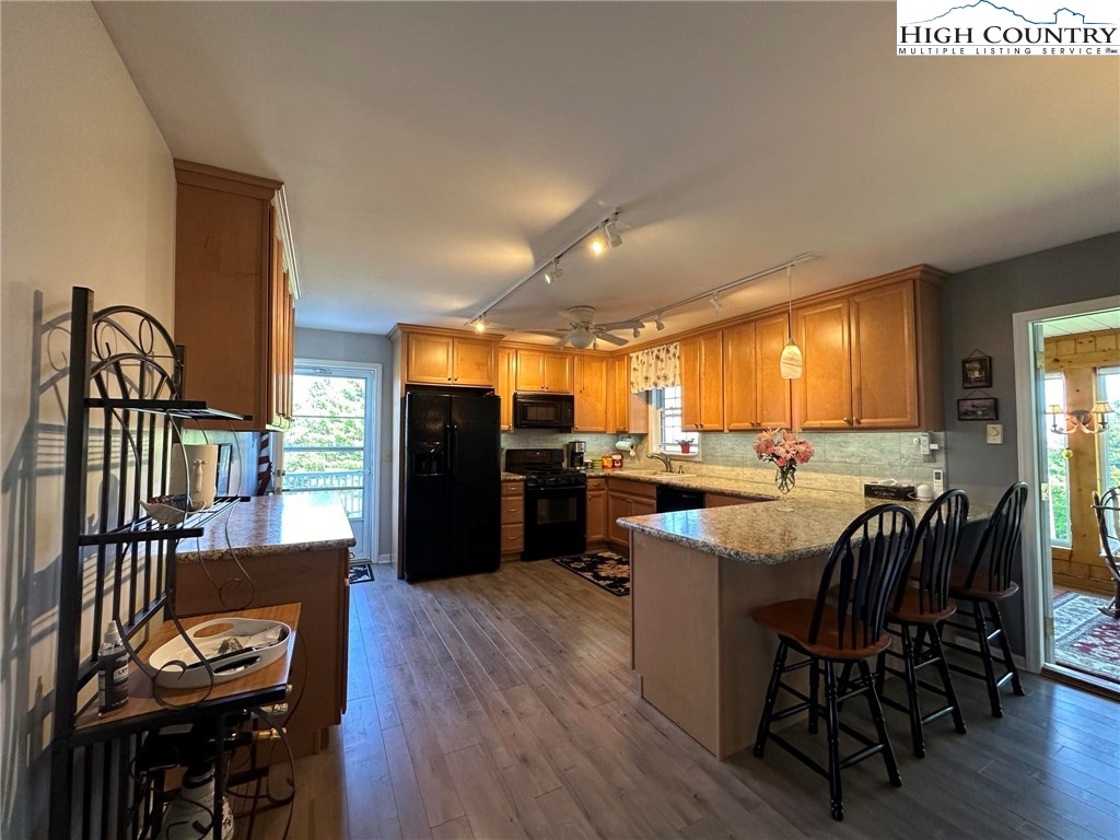 4952 Nile Road Sparta, NC 28675 - Photo 10 of 36 a kitchen with a table chairs stove and cabinets
