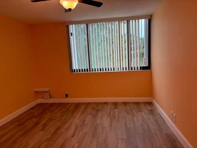 wooden floor and window in an empty room